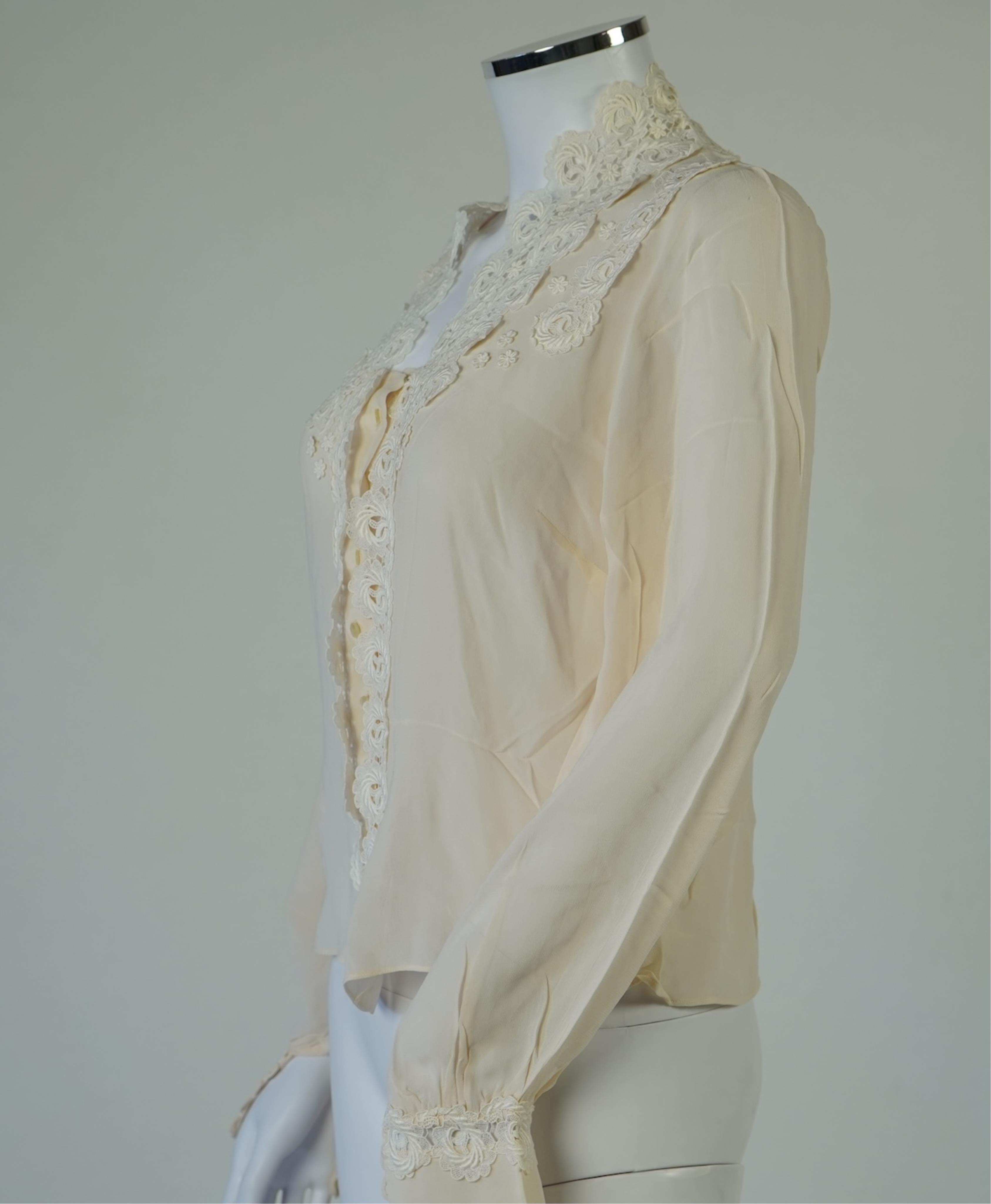 A 1940’s-50’s short sleeve lime green silk embroidered blouse, a pale pink silk crepe long sleeved blouse with white lace and a late 19th century navy silk chiffon blouse. Condition - the navy blouse is fragile but may b